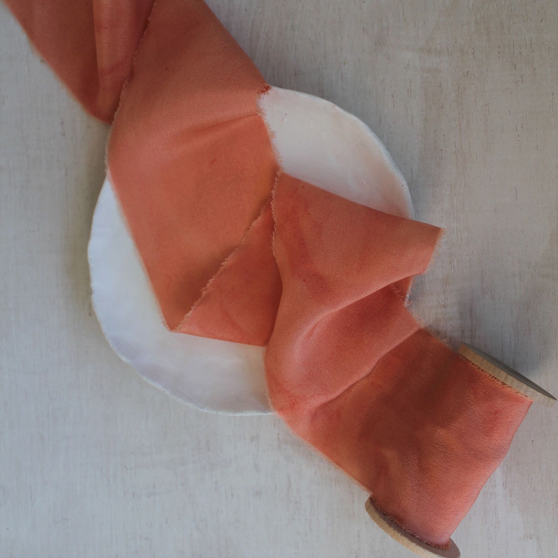 Natural dye coral peach silk ribbon hand-torn with feathered edges, perfect for DIY wedding crafts and stationery