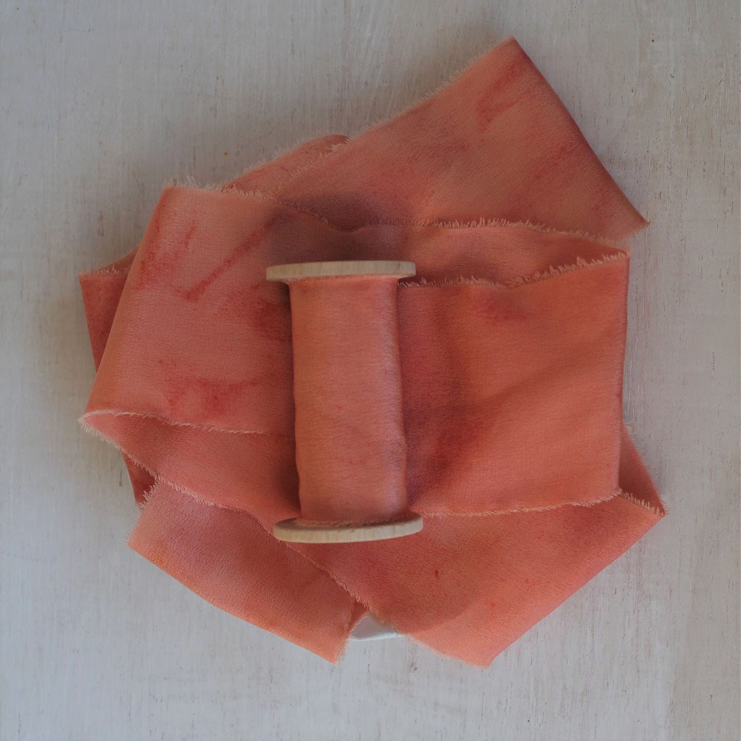 Hand-torn coral peach silk ribbon from crepe de chine, natural dye process, and perfect for fine art styling.